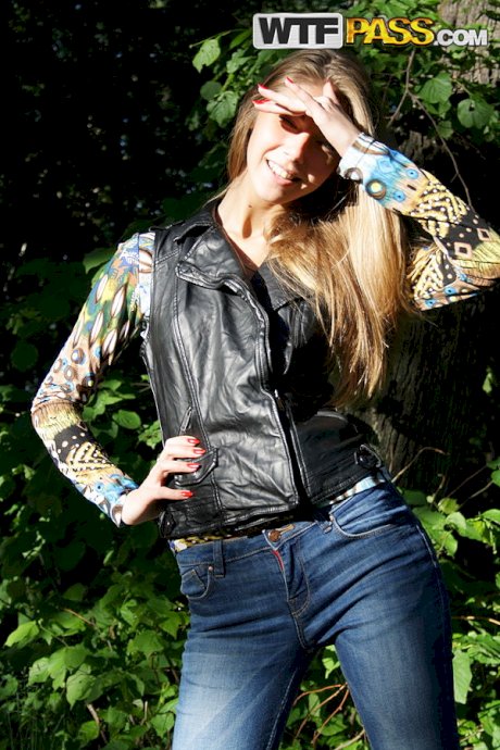 Slim amateur uncovers her small tits in blue jeans during homemade action